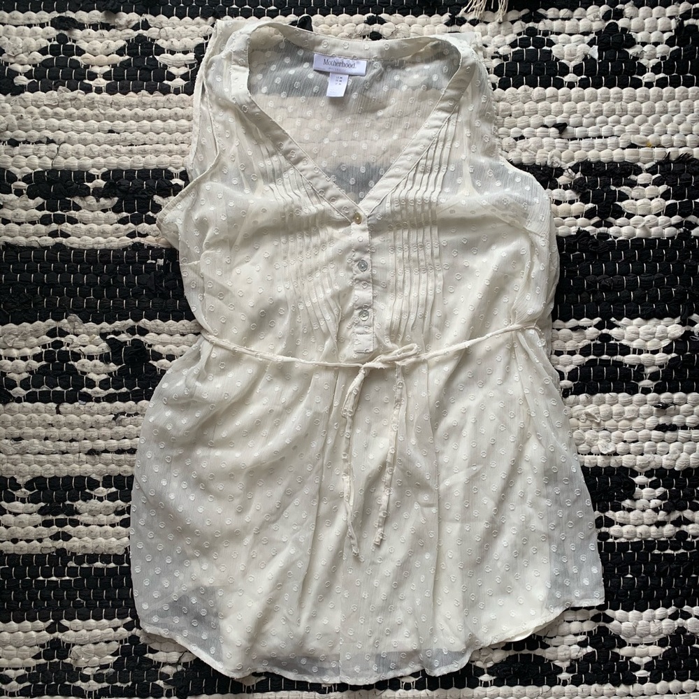 Women’s sleeveless white maternity blouse